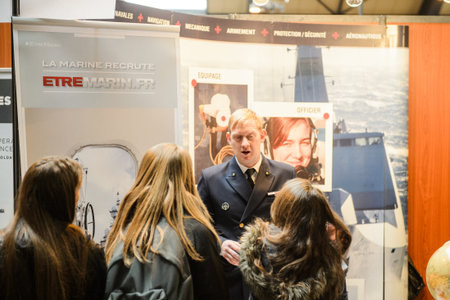 STRASBOURG, FRANCE - FEB 4, 2016: Children and teens of all ages attending annual Education Fair to choose career path and receive vocational counseling - French Marine recruitingのeditorial素材