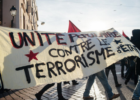 STRASBOURG, FRANCE - FEB 6, 2016: Protesters marching with no border no nation placard during a...