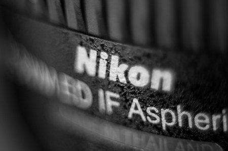 FRANKFURT, GERMANY - SEPT 19, 2011: Focusing technique effect over the Nikon Lens. Nikon is a Japanese multinational corporation headquartered in Tokyo, Japan, specializing in optics and imaging products.のeditorial素材
