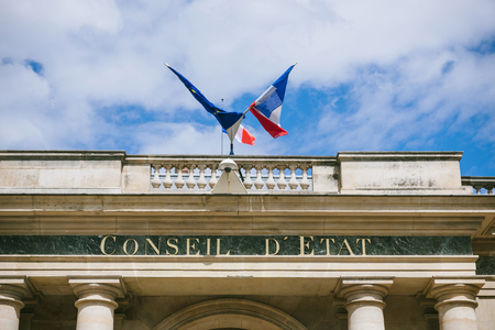 Conseil d'Etat - Council of State building with French flag and Europena Union Flag in Paris France. Council of State is a body of the French national government that acts both as legal adviser of the executive branch and as the supreme court for administのeditorial素材