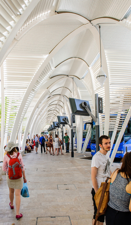 AIX-EN-PROVENCE, FRANCE - JUL 18, 2014: Tourists waiting in line and looking at electronic monitor for the schedule of the departure and arrival of buses in the central bus station in Aix-En-Provence, Franceのeditorial素材