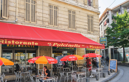 MARSEILLE, FRANCE - JUL 18, 2014: Ristorante Pizzeria Pulcinella a fompus ready to eat pizza restaurant in the center of Marseille, Franceのeditorial素材