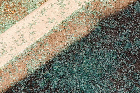 Broken glass part on asphalt after accidentの写真素材