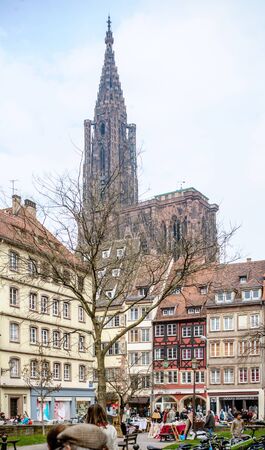 STRASBOURG, FRANCE - MARCH 21, 2015: City of Strasbourg with tourists admiring the city and Cathedral - Cathedrale Notre-Dame de Strasbourgのeditorial素材