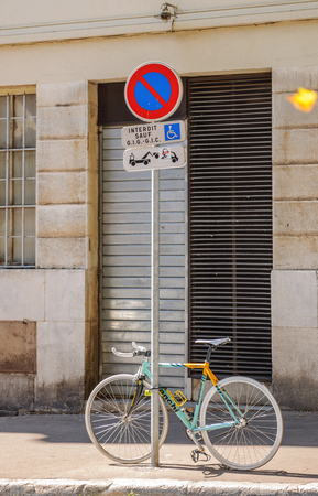 AIX-EN-PROVENCE, FRANCE - JUL 17, 2014: Bianchi high performance bike parked on a street-sign on the street of Marseilles.のeditorial素材