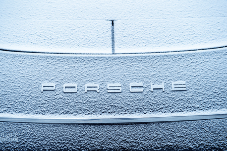 PORSCHE logotype covered with snow flakes. On 18 September 2015, the United States Environmental Protection Agency EPA issued a notice of violation of the Clean Air Act to German automaker Volkswagen Group, after it was found that the car maker had intentのeditorial素材