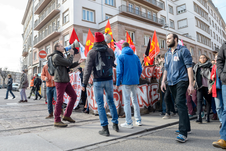 STRASBOURG, FRANCE - 9 MAR 2016: People blocking street as thousands of people demonstrate as part of nationwide day of protest against proposed labor reforms by Socialist Governmentのeditorial素材