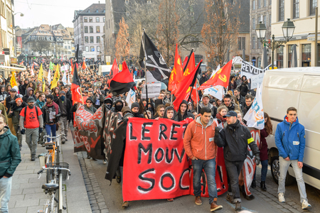 STRASBOURG, FRANCE - 9 MAR 2016: Crowd marching on the Rue du Vieux Marche aux Poissons as part of nationwide day of protest against proposed labor reforms by Socialist Governmentのeditorial素材