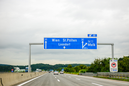 AUSTRIA - SEP 18, 2013: Austrian Federal Motorway highway direction sign - direction sign to Wien, St Polten, loosdorf, Melk. Useful file for your flyer about European and German road infrastructure and other needsのeditorial素材