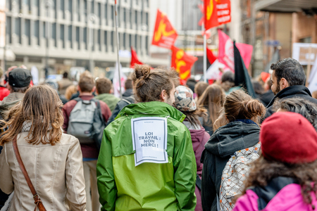 STRASBOURG, FRANCE - 9 MAR 2016: Work rule - no, thank you on back as thousands of people demonstrate as part of nationwide day of protest against proposed labor reforms by Socialist Governmentのeditorial素材