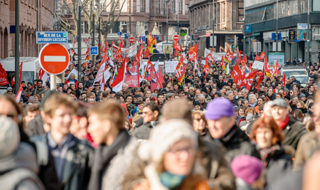STRASBOURG, FRANCE - 9 MAR 2016: Thousands of people demonstrate as part of nationwide day of protest against proposed labor reforms by Socialist Government in the center of Strasbourgのeditorial素材