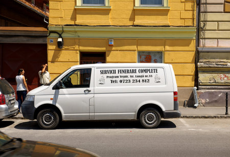 BRASOV, ROMANIA - JUL 5, 2015: Funeral service van on the streets of Brasov, Romania
