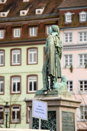 STRASBOURG, FRANCE - MAR 19, 2016: General Kleber statue and No to Russian Occupation placard as...