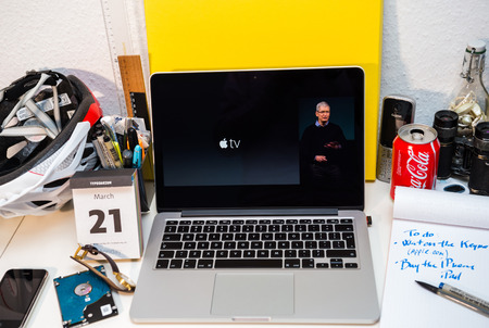 PARIS, FRANCE - MARCH 21, 2016: Apple Computers website on MacBook Pro Retina in a creative room environment showcasing Apple Event with Tim Cook presenting Apple TVのeditorial素材