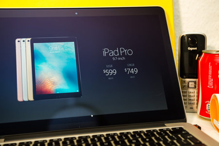 PARIS, FRANCE - MARCH 21, 2016: Apple Computers website on MacBook Pro Retina in a creative room...