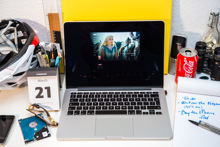 PARIS, FRANCE - MARCH 21, 2016: Apple Computers website on MacBook Pro Retina in a creative room environment showcasing Apple Event with new Game of Thron TV appのeditorial素材