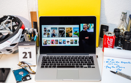 PARIS, FRANCE - MARCH 21, 2016: Apple Computers website on MacBook Pro Retina in a creative room environment showcasing Apple Event with Tim Cook and Apple Tv appのeditorial素材