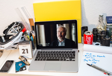 PARIS, FRANCE - MARCH 21, 2016: Apple Computers website on MacBook Pro Retina in a creative room environment showcasing Apple Event with Apple COO Jeff Williams and Care Kit presentationのeditorial素材