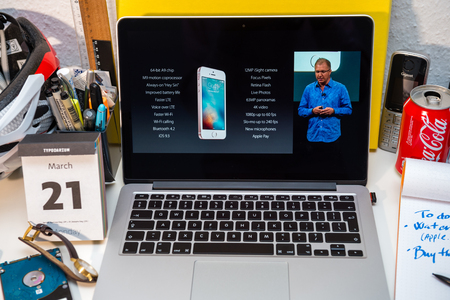 PARIS, FRANCE - MARCH 21, 2016: Apple Computers website on MacBook Pro Retina in a creative room environment showcasing Apple Event with Greg Joswiak presenting all specs of iPhone seのeditorial素材
