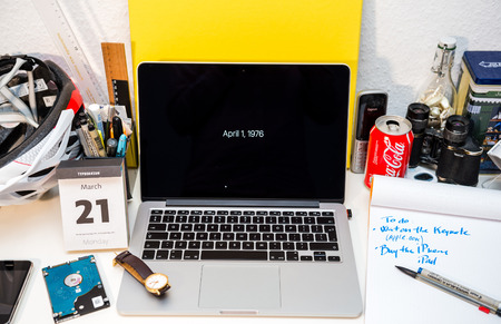 PARIS, FRANCE - MARCH 21, 2016: Apple Computers website on MacBook Pro Retina in a creative room environment showcasing Apple Event with April 1, 1976 - date of Apple Computer foundingのeditorial素材