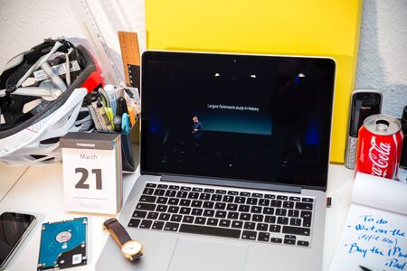 PARIS, FRANCE - MARCH 21, 2016: Apple Computers website on MacBook Pro Retina in a creative room environment showcasing Apple Event with Apple COO Jeff Williams and Care Kit presentationのeditorial素材