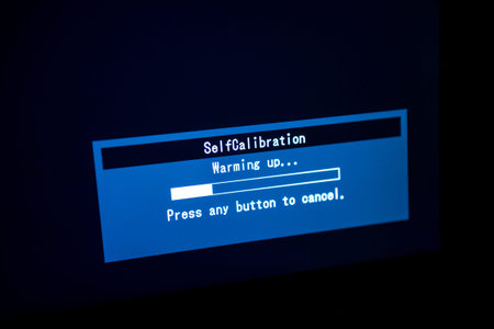 Self calibration warming up of a modern monitor with integrated color calibration device in creative environmentの写真素材