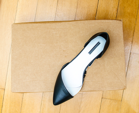 New leather summer collection shoes on a cardboard boxの写真素材