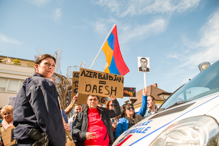 STRASBOURG, FRANCE - APR 8, 2016: Armenian diaspora protest outside Azerbaijan Embassy against the 2016 clashes in Nagorny-Karabakh, the region disputed by Armenia and Azerbaijanのeditorial素材