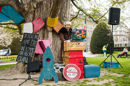 STRASBOURG, FRANCE - APR 9, 2016: Dj performing under a tree as people join the 'Nuit Debout' or 'Standing night' movement at the Place de la Republique in Strasbourgのeditorial素材