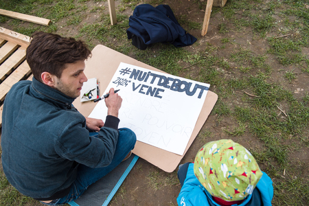 STRASBOURG, FRANCE - APR 9, 2016: Man writing Come to Nuit de Debout during 'Nuit Debout' or 'Standing night' movement at the Place de la Republique in Strasbourgのeditorial素材