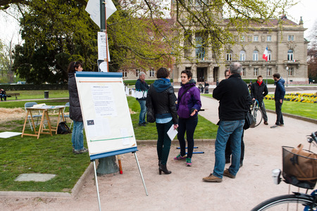 STRASBOURG, FRANCE - APR 9, 2016: Flipchart with revolutionary text at 'Nuit Debout' or 'Standing night' movement at the Place de la Republique in Strasbourgのeditorial素材