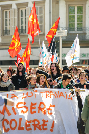 STRASBOURG, FRANCE - APR 20, 2016: Crowd yelling as hundreds of people demonstrate as part of nationwide day of protest against proposed labor reforms by Socialist Governmentのeditorial素材