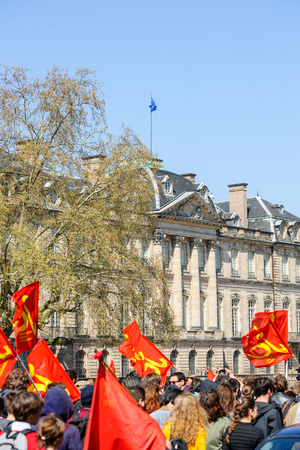 STRASBOURG, FRANCE - APR 20, 2016: Hundreds of people demonstrate with Palais Rohan behind as part of nationwide day of protest against proposed labor reforms by Socialist Governmentのeditorial素材