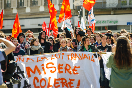 STRASBOURG, FRANCE - APR 20, 2016: Crowd yelling as hundreds of people demonstrate as part of nationwide day of protest against proposed labor reforms by Socialist Governmentのeditorial素材