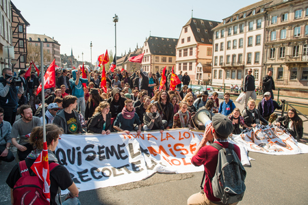STRASBOURG, FRANCE - APR 20, 2016: Die-in on central Strasbourg as hundreds of people demonstrate as part of nationwide day of protest against proposed labor reforms by Socialist Governmentのeditorial素材