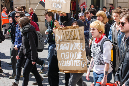 STRASBOURG, FRANCE - APR 20, 2016: Young students on street demonstrate as part of nationwide day of protest against proposed labor reforms by Socialist Governmentのeditorial素材