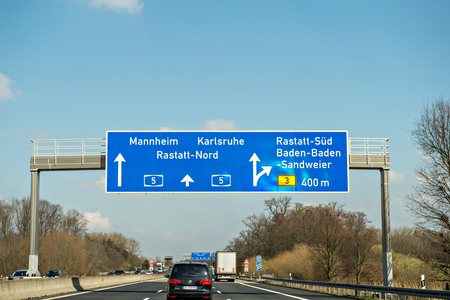 GERMANY - MAR 26, 2016: Bundesautobahn or Federal Motorway highway street signs to Mannheim, Karsruhe, Rastatt-Nord, Baden-Baden and Sandweierのeditorial素材