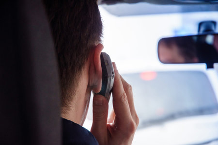 Man using phone while driving the car