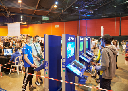 STRASBOURG, FRANCE - MAY 8, 2015: Kids and adults playing PS 4 game consoles at the open market Digital Game Manga Showのeditorial素材