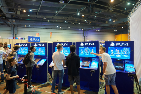 STRASBOURG, FRANCE - MAY 8, 2015: Kids and adults playing PS 4 game consoles at the open market Digital Game Manga Showのeditorial素材