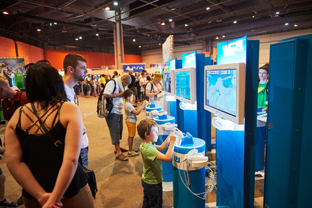 STRASBOURG, FRANCE - MAY 8, 2015: Kids and adults playing WII U game consoles at the open market Digital Game Manga Showのeditorial素材