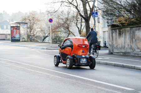 MULHOUSE, FRANCE - DEC 19, 2016: Renault Twizi electric car driving on the street of Mulhouse,...