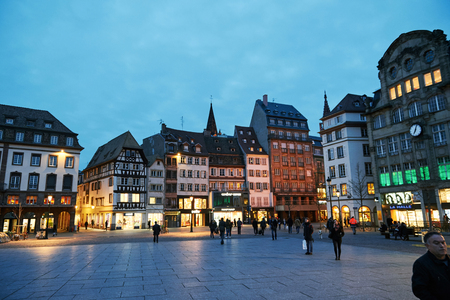 STRASBOURG, FRANCE - MAR 24, 2016: Place Kleber UNESCO World Heritage site in central Strasbourg, with tourist admiring the city at the eveningのeditorial素材