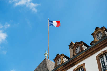 French flag above old City Hall in Franceの写真素材
