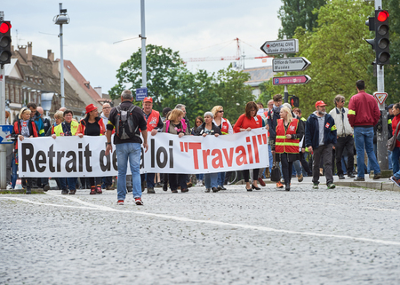 STRASBOURG, FRANCE - MAY 19, 2016: People marching on closed central streets in Strasbourg woth retire labor reform placard during a demonstration against proposed French government's labor and employment law reformのeditorial素材