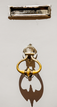 Door knocker old vintage and mail box on old door French cityの写真素材
