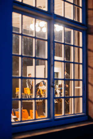 STRASBOURG, FRANCE - MAR 18, 2016: View through the window of a building at the classical music orchestra team preparing for the concert in Strasbourg, Franceのeditorial素材