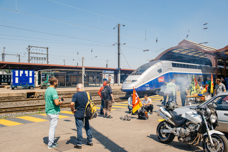STRASBOURG, FRANCE - JUN 6, 2016: Protesters making barbeque outside the Gare de Strasbourg, during a demonstration by railway workers of French state rail operator SNCF, as part of a strike to defend their work conditions.のeditorial素材