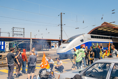 STRASBOURG, FRANCE - JUN 6, 2016: Protesters making barbeque outside the Gare de Strasbourg, during a demonstration by railway workers of French state rail operator SNCF, as part of a strike to defend their work conditions.のeditorial素材