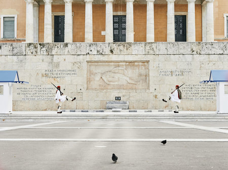 Athens, Greece - March 27, 2016: Perfect the coordination of movements during the changing of the honor Evzones guards ceremony in front of  the Tomb of the Unknown Soldier at the Parliament Building in Syntagma Square, Athens, Greece.のeditorial素材